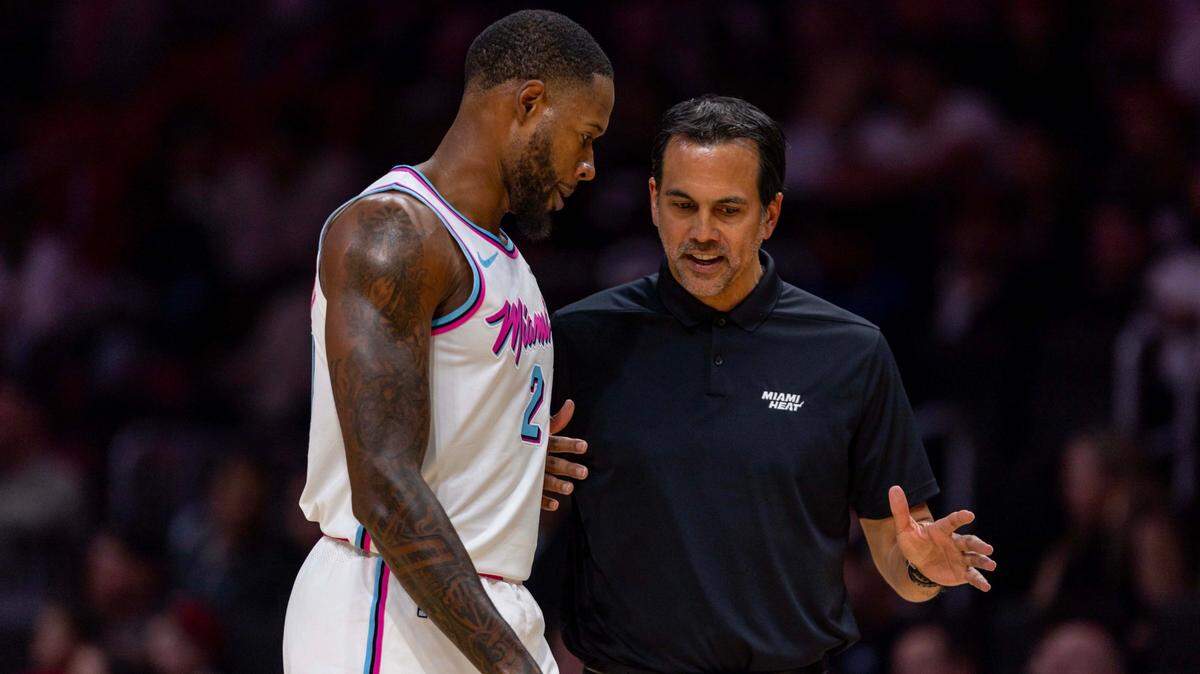 Miami Heat Head Coach Erik Spoelstra speaks with forward Haywood Highsmith (24) during the first half of an NBA game against the Orlando Magic at Kaseya Center on January 27, 2025, in Miami.
