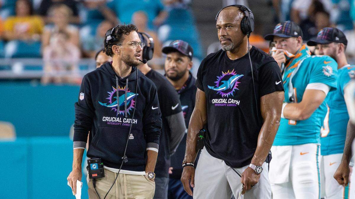 Miami Dolphins head coach Mike McDaniel and Dolphins defensive coordinator Anthony Weaver look from tye sidelines in the second half of their NFL game against the Tennessee Titans at Hard Rock Stadium on Monday, Sept. 30, 2024, in Miami Gardens, Fla.