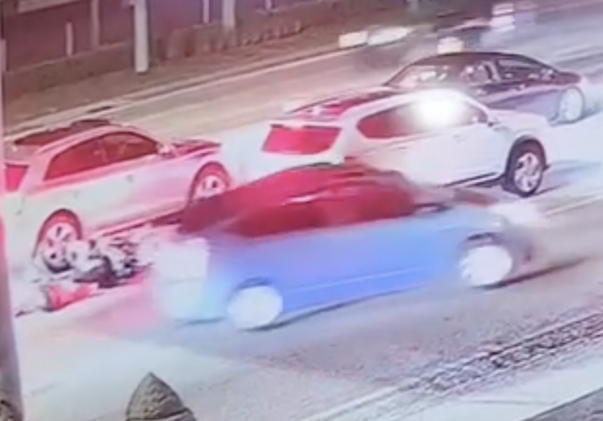 A photo of the blue car that rammed into a man on a scooter on East Sunrise Blvd. Saturday night.