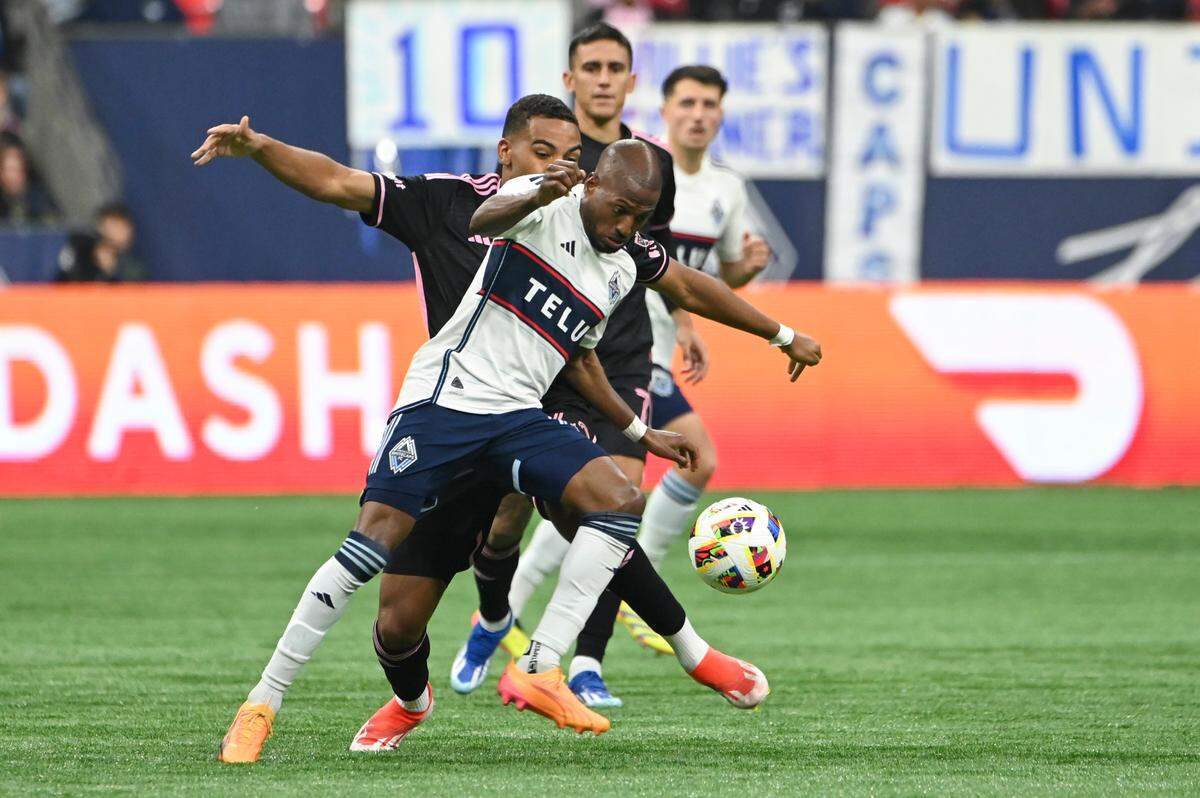 May 25, 2024; Vancouver, British Columbia, CAN; Vancouver Whitecaps FC forward Fafa Picault (11) controls the ball against Inter Miami CF defender Yannick Bright (42) during the second half at BC Place. Mandatory Credit: Simon Fearn-USA TODAY Sports
