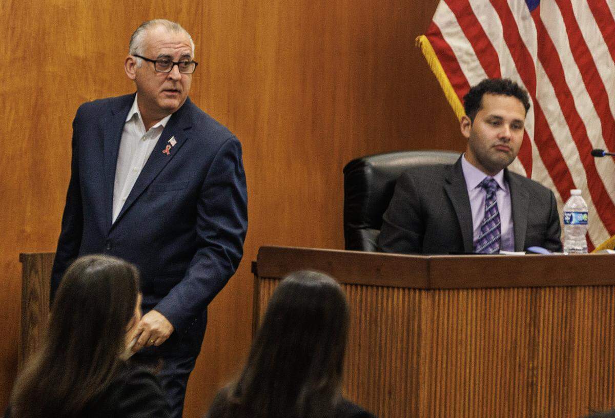 City of Hialeah then-Mayor Esteban Bovo, Jr. walks by then-councilmen Bryan Calvo, during a council meeting at city hall, on Tuesday, October 24, 2023.