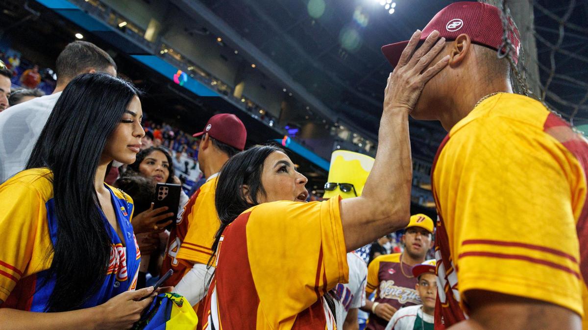 Venezuela starting pitcher Jesus Luzardo (44) talks with his mother Monica after the Pool D game against Israel at the World Baseball Classic at loanDepot Park on Wednesday, March 15, 2023, in Miami, Fla.