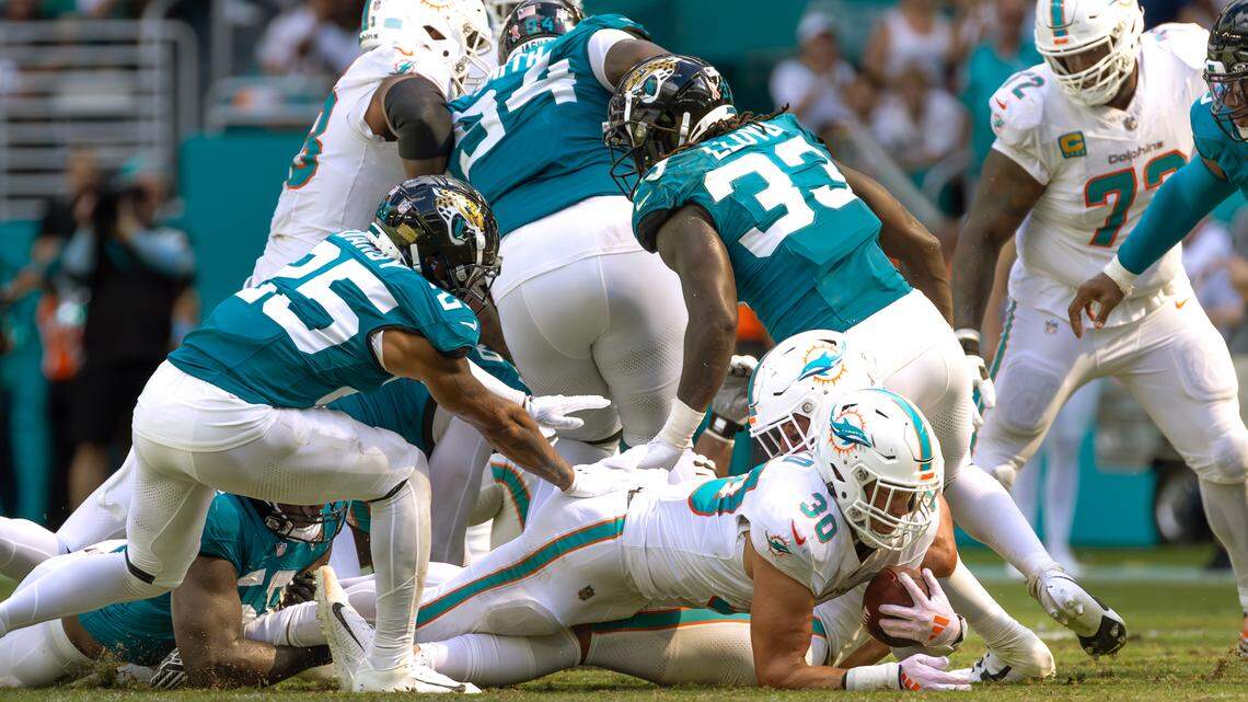 Miami Dolphins fullback Alec Ingold (30) runs for a first down during the second half of an NFL football game against the Jacksonville Jaguars at Hard Rock Stadium on Sunday, Sep. 8, 2024, in Miami Gardens, Fl.