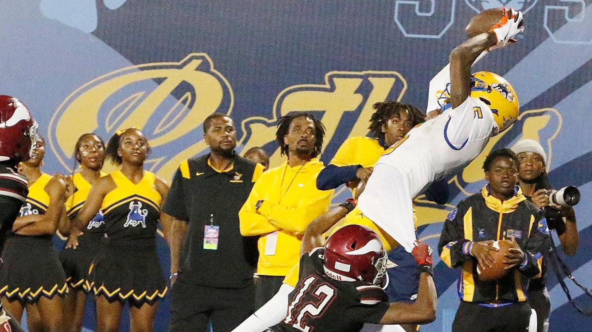 Northwestern Bulls wide receiver Calvin Russell Jr. catches a pass during Class 3A state championship football game against the Raines Vikings (Jacksonville) on Saturday, December 14, 2024 at Pitbull Stadium in Miami. 
