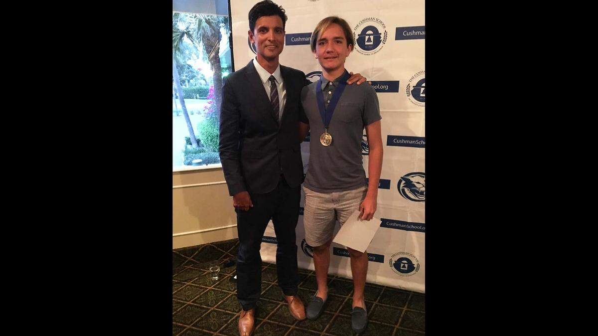 Franco Di Paolo, right, is advocating for a bill to help millions of people who rely on battery-powered medical devices during power outages. He is shown here receiving a Director of Athletics Leadership Award from Pablo Gentile at The Cushman School.