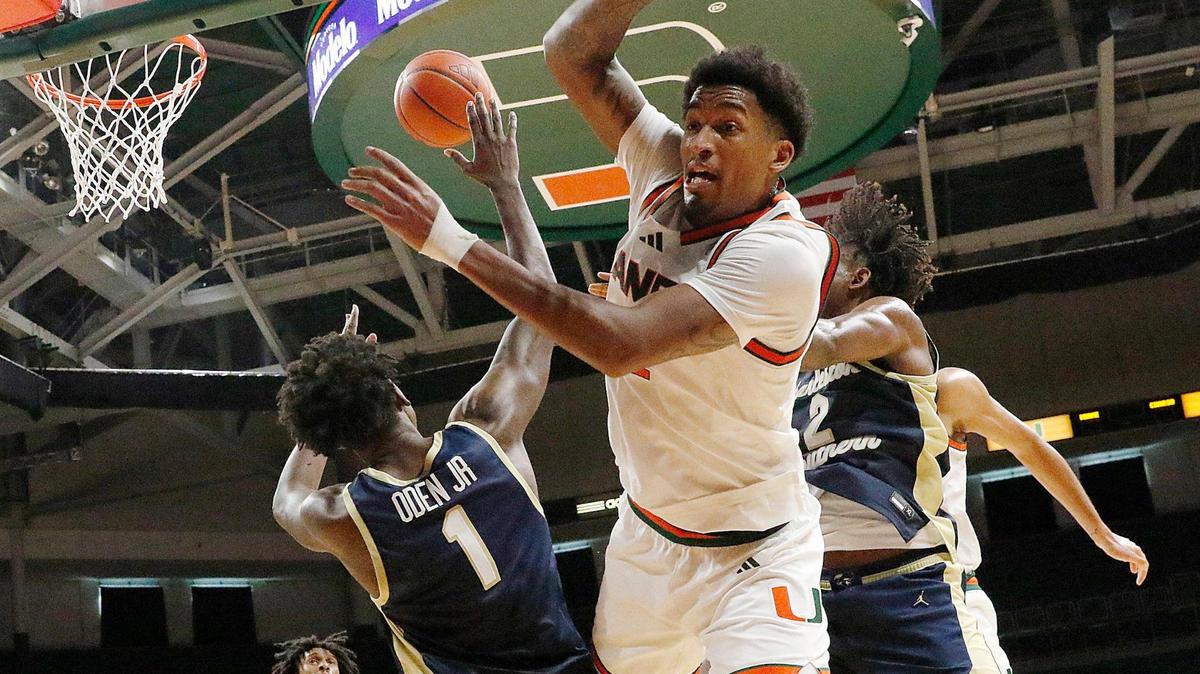 UM Hurricanes Brandon Johnson (2) and Charleston Southern University Buccaneers Lamar Oden Jr. (1) fight for a rebound during the basketball game on Saturday, November 30, 2024 at Watsco Center in Coral Gables. Andrew Uloza / for Miami Herald