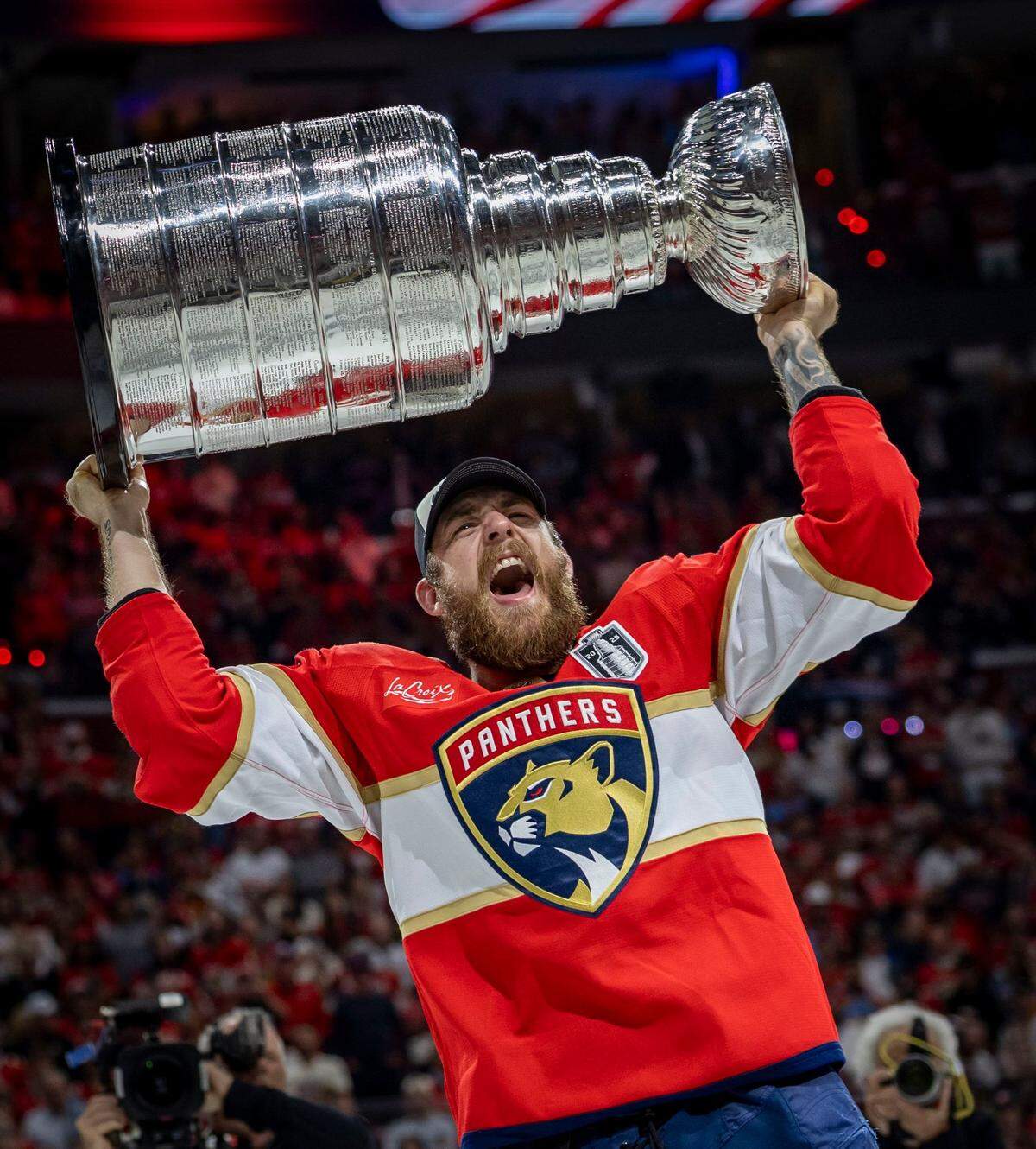 Florida Panthers left wing A.J. Greer (10) lifts the Stanley Cup after the Panthers defeated the Edmonton Oilers in Game 6 