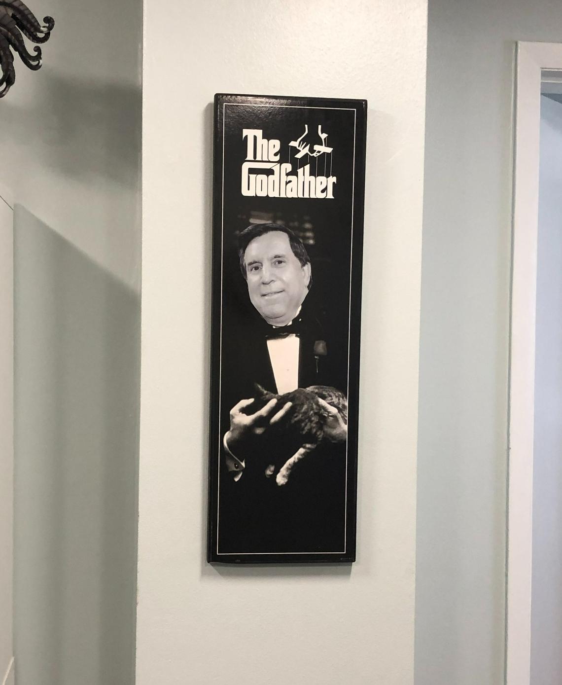 A framed photo of Miami Commissioner Joe Carollo with his face superimposed over the body of Vito Corleone, the titular character from the mobster film “The Godfather,” was spotted hanging in Carollo’s City Hall office.