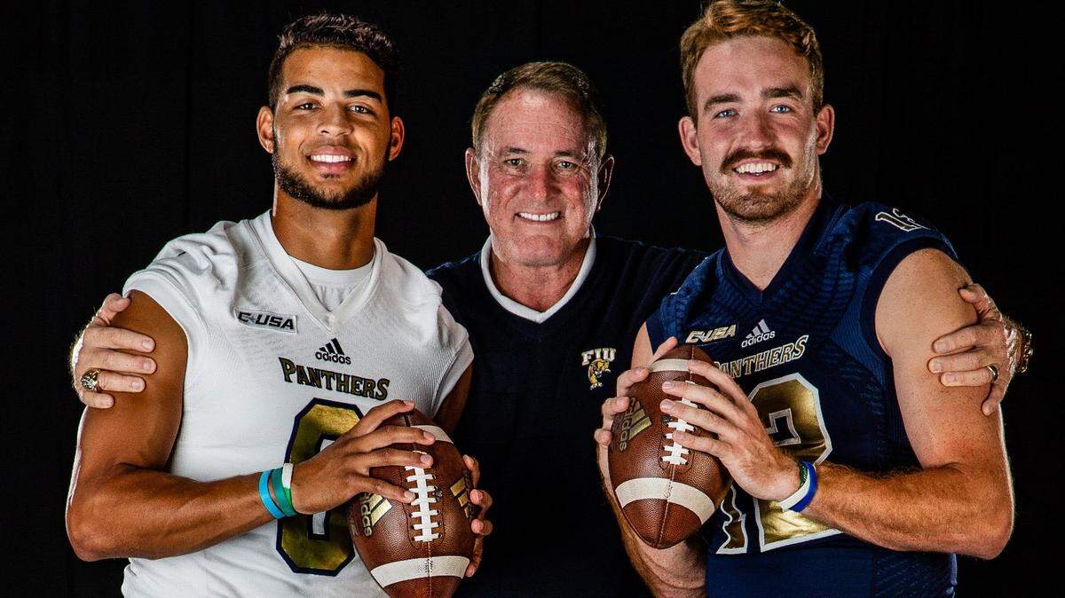 Butch Davis with quarterbacks Christian Alexander and James Morgan as they pose for a photograph at Riccardo Silva Stadium on Wednesday, August 8, 2018.