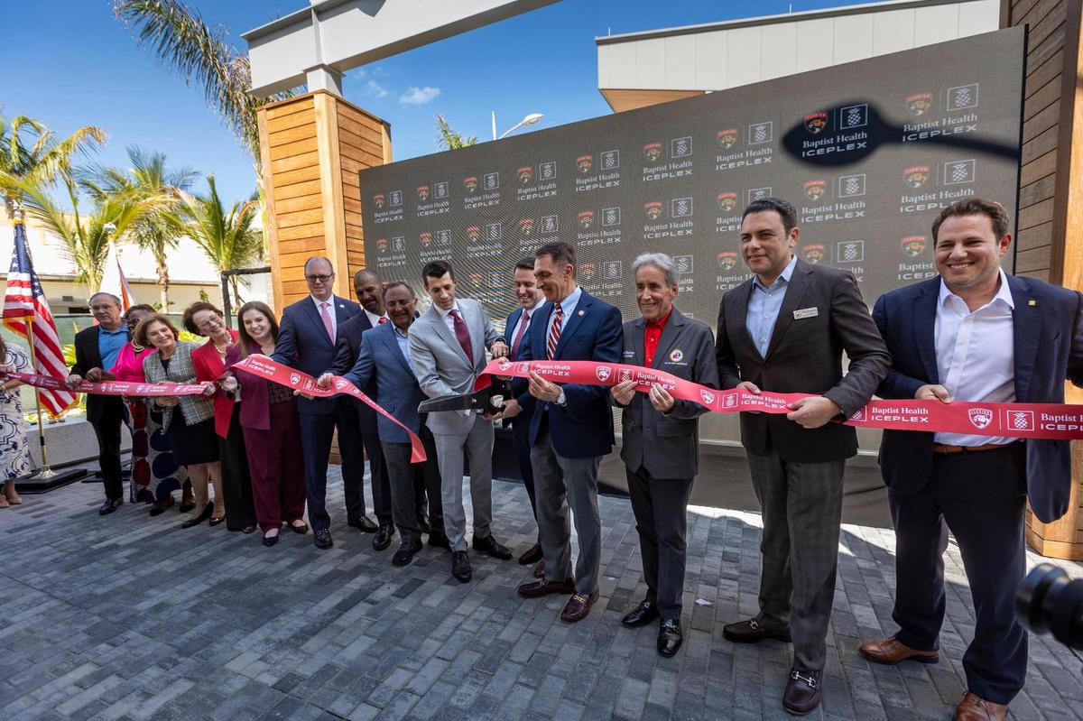 Fort Lauderdale, Florida, March 19, 2024 - Michael Viola, center, son of Florida Panthers owner Vincent Viola cuts the ribbon to the newly constructed Baptist Health IcePlex in Fort Lauderdale along with elected officials and honored guests from Baptist Hospital, the city of Fort Lauderdale and the Florida Panthers