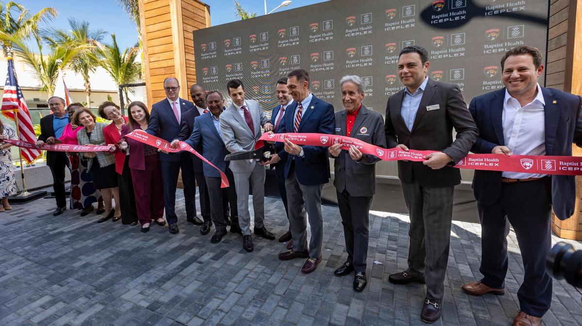 Michael Viola, center, son of Florida Panthers owner Vincent Viola cuts the ribbon to the newly constructed Baptist Health IcePlex in Fort Lauderdale along with elected officials and honored guests from Baptist Hospital, the city of Fort Lauderdale and the Florida Panthers