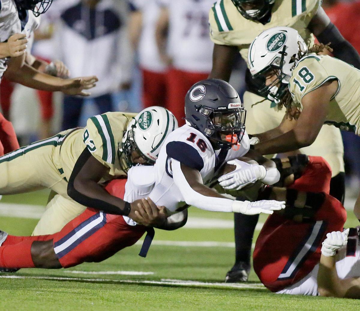 Miami Central Rockets defender tackles Columbus Explorers running back Tremonte Underwood Jr. (16) during football game on Friday, October 21, 2022 at Traz Powell Stadium in Miami. Andrew Uloza / for Miami Herald