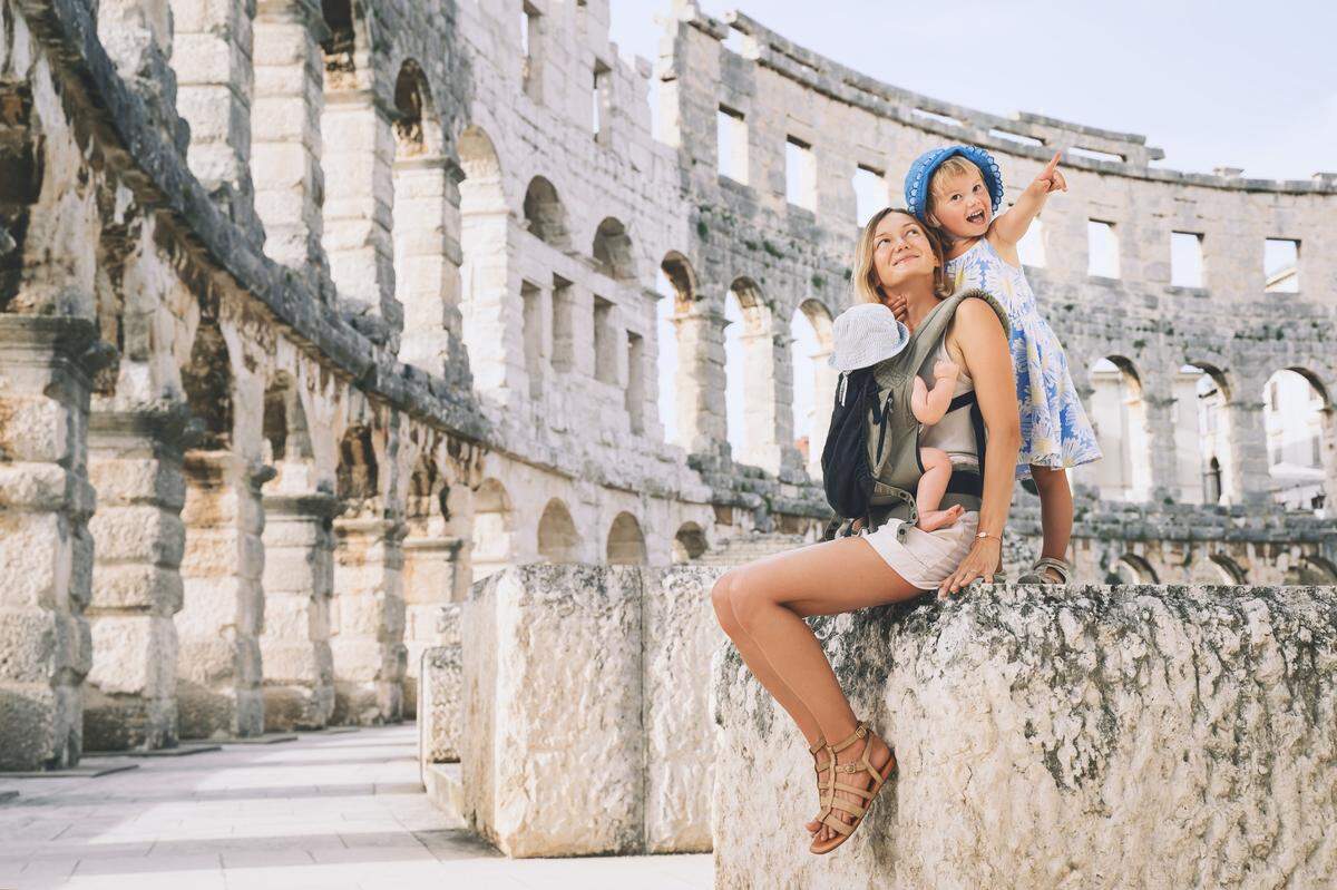 mother with kids at roman ampitheatre