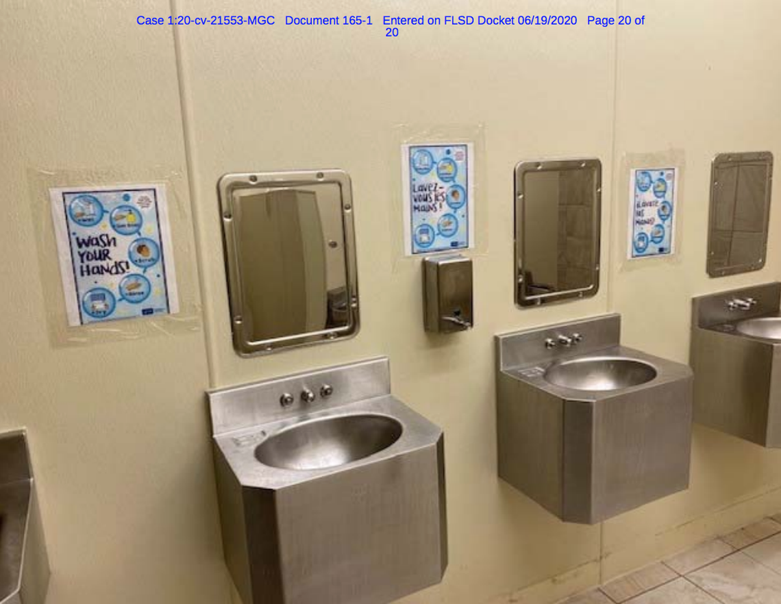 Educational signage posted inside a Glades detention center restroom.