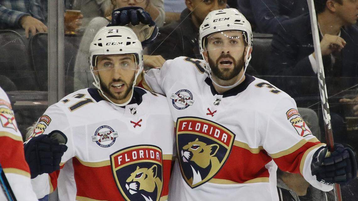 The Panthers’ Vincent Trocheck, left, celebrates his power-play goal at 18:15 of the first period against the New York Rangers and is joined by Keith Yandle at Madison Square Garden on Oct.  23, 2018 in New York City.