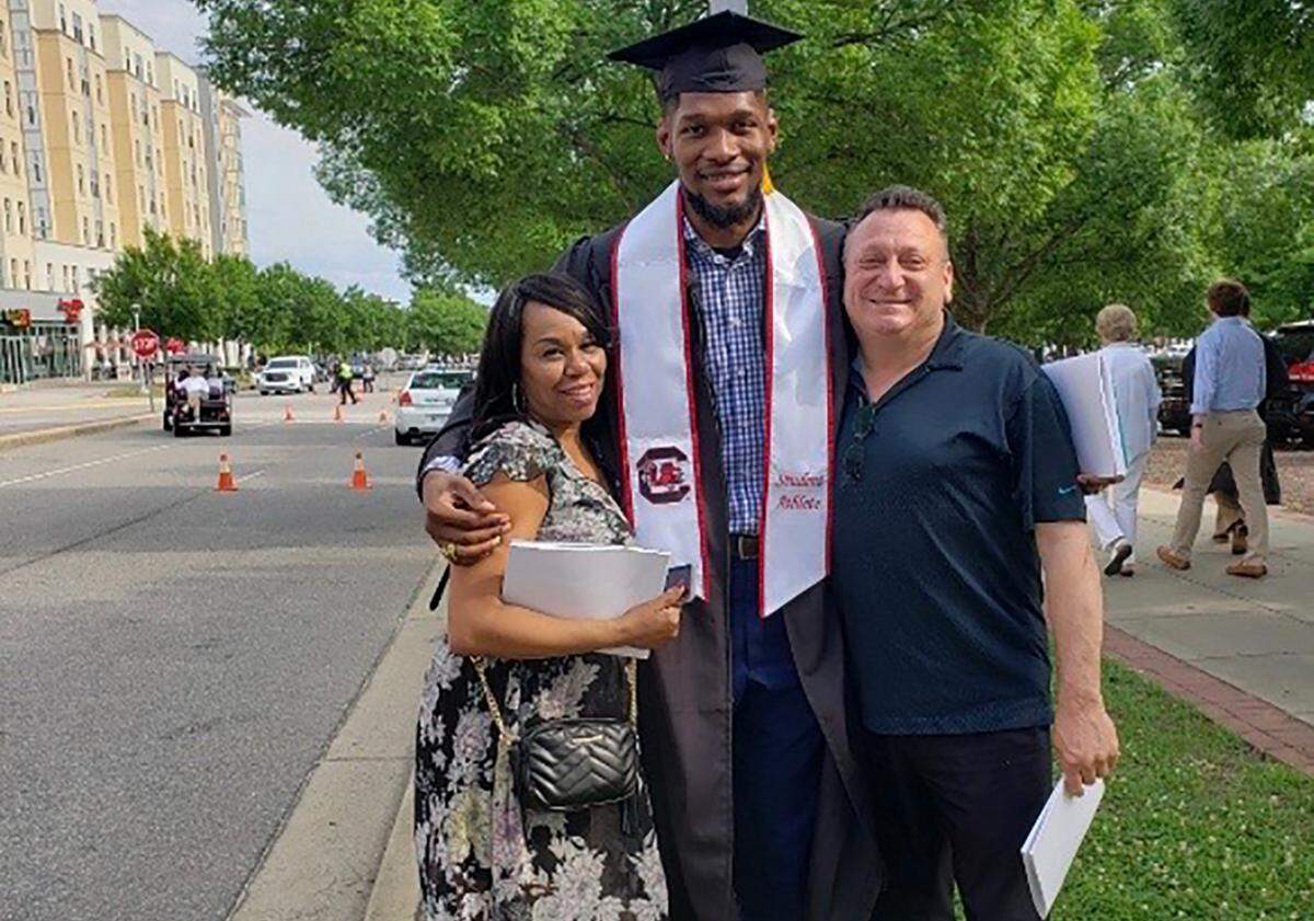 Miami Heat rookie Chris Silva alongside Tommy Sacks and Sacks’ wife, Phyllis, after graduating from the University of South Carolina.