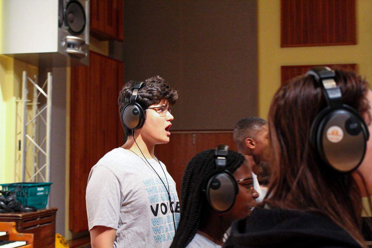 The Children’s Voice Chorus member Israel Arroyo practices during a recording at Miami’s Criteria Studios. Working with well-known music director Greg Philinganes, the chorus recorded the vocals for “America the Beautiful” at the studio.