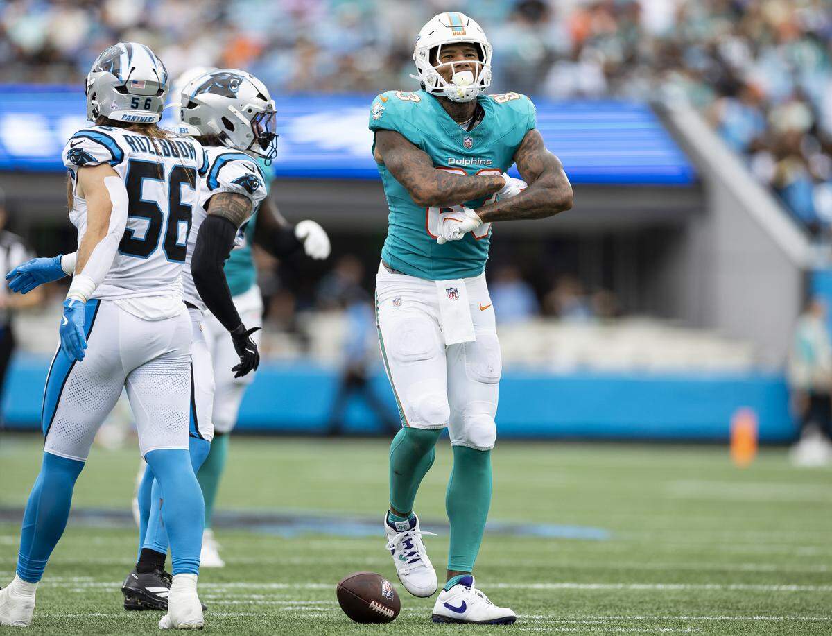 Miami Dolphins tight end Darren Waller (83) reacts after catching a pass against the Carolina Panthers in the first half of their NFL game at the Bank of America Stadium on Sunday, Oct. 5, 2025, in Charlotte, N.C.