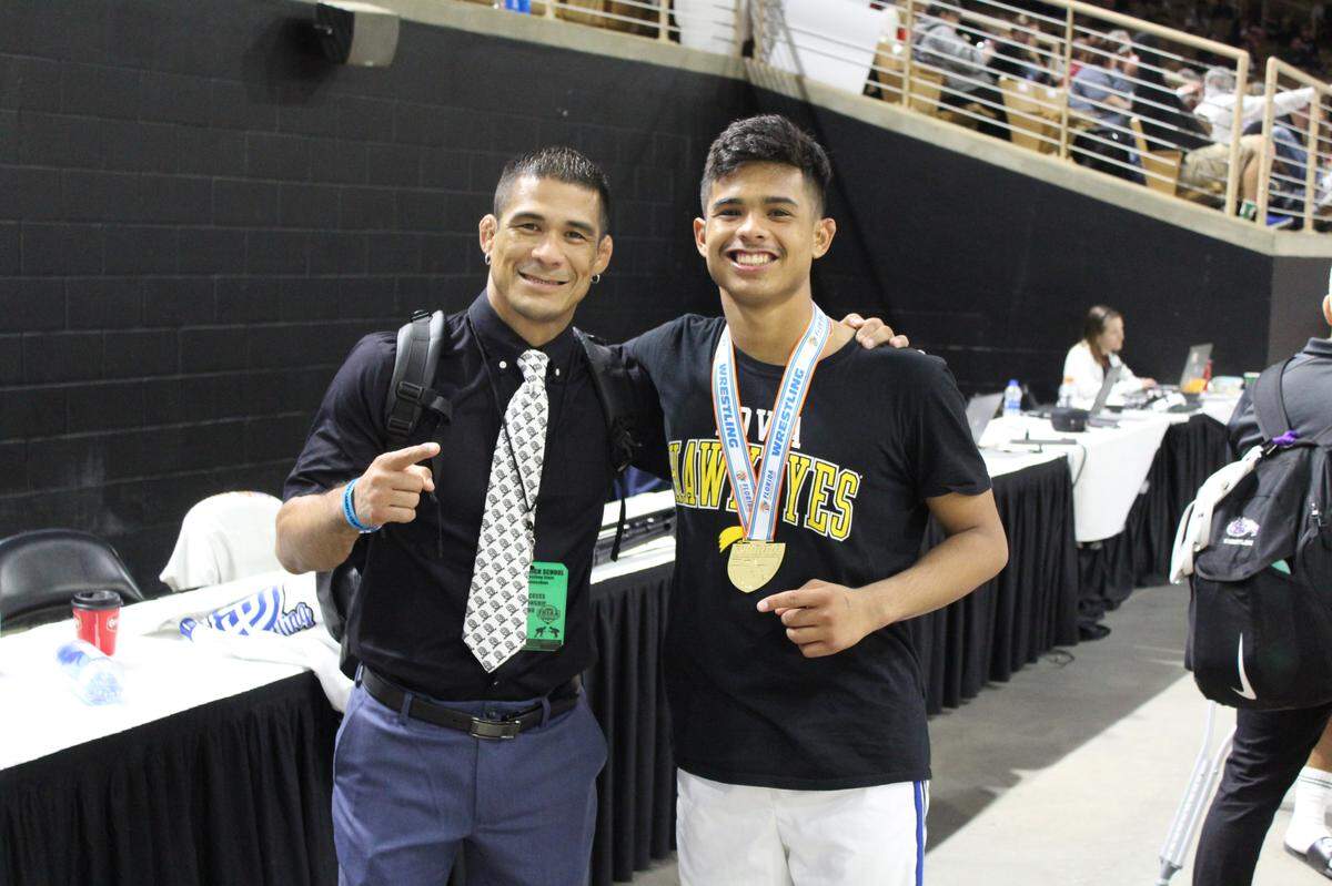 Long-time South Dade assistant coach Humberto Reyna played the role of proud father on Saturday night as he watched his son Bretli go into the record books by becoming only the second wrestler in Miami-Dade County history to win four consecutive state titles.