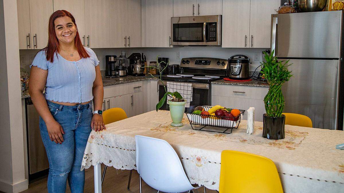 Jennifer Garcia, a lifeguard with the city of Miami, posed at her leased apartment at the affordable housing project Liberty Square in Miami.