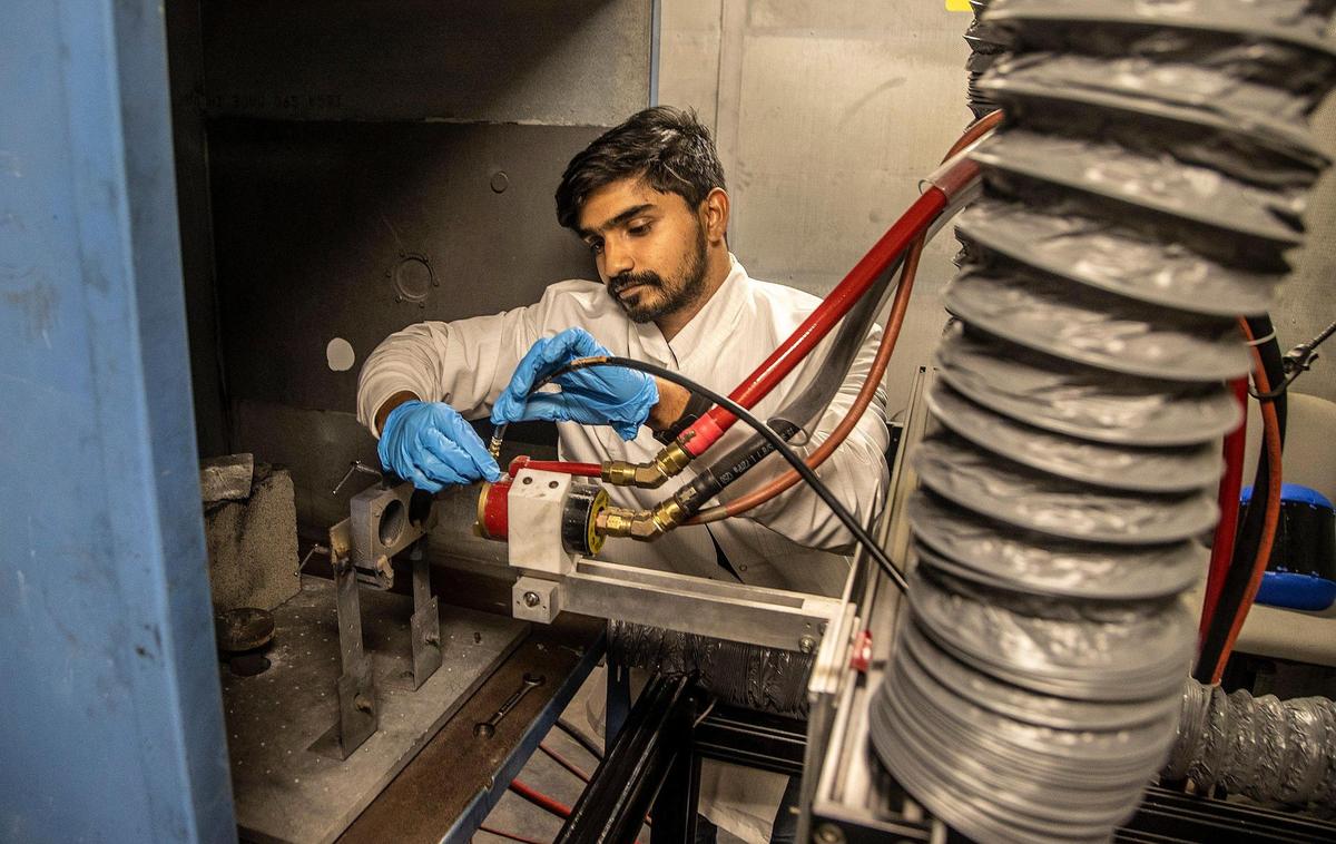 Assistant Researcher Abhijith KS works at a machine used for Cold Spray and Rapid Deposition (ColRAD) research done at the FIU’s College of Engineering & Computing in Miami.