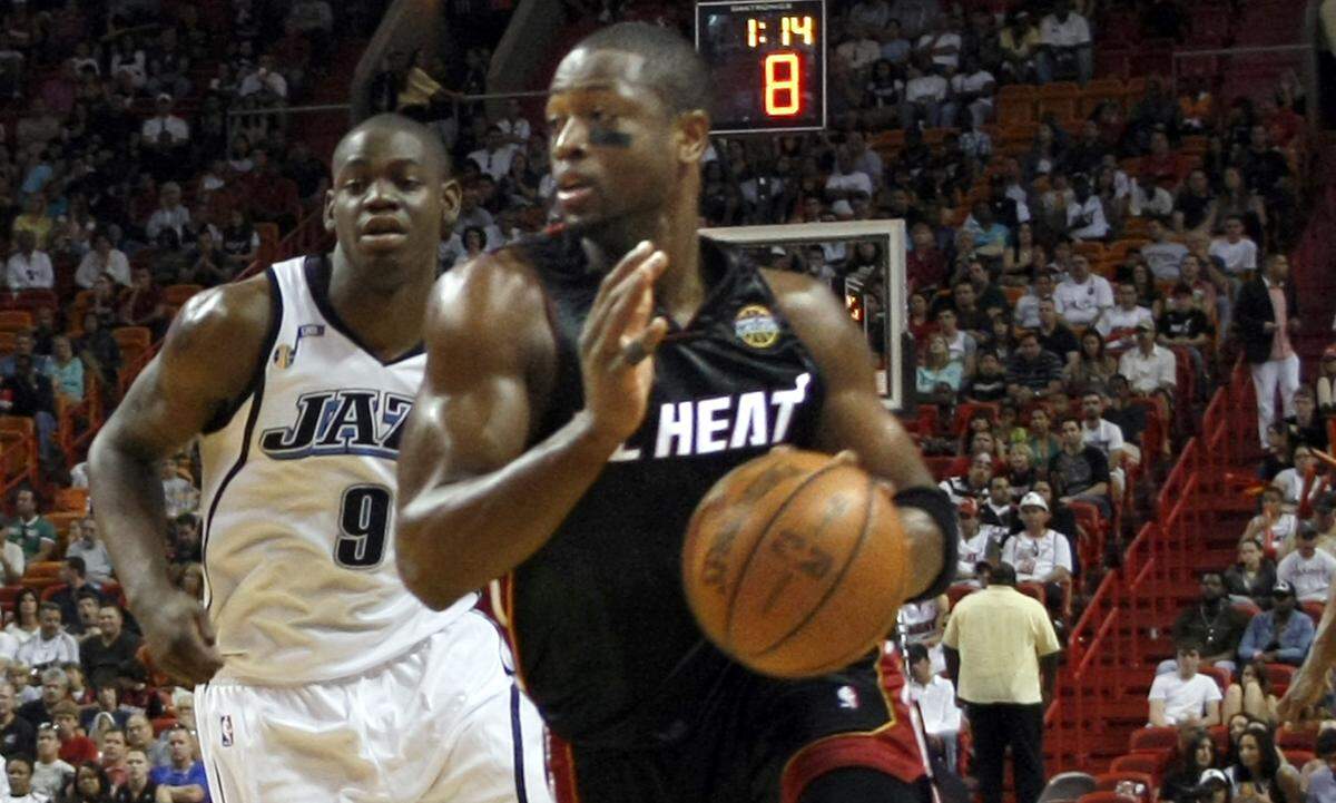 Utah Jazz- Jazz’s Ronnie Brewer (9), follows the Miami Heat’s Dwyane Wade as he drives the ball during the third quarter of the NBA game against the Utah Jazz at American Airlines Arena in Miami, Florida, on Saturday, March 14, 2009.