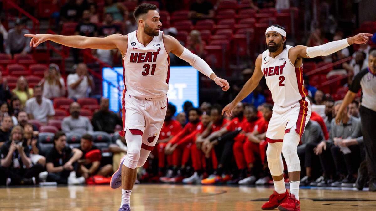 Miami Heat forward Max Strus (31) and point guard Gabe Vincent (2) motion to teammates during the first half of an NBA play-in tournament game against the Chicago Bulls at Kaseya Center in Downtown Miami, Florida, on Friday, April 14, 2023.