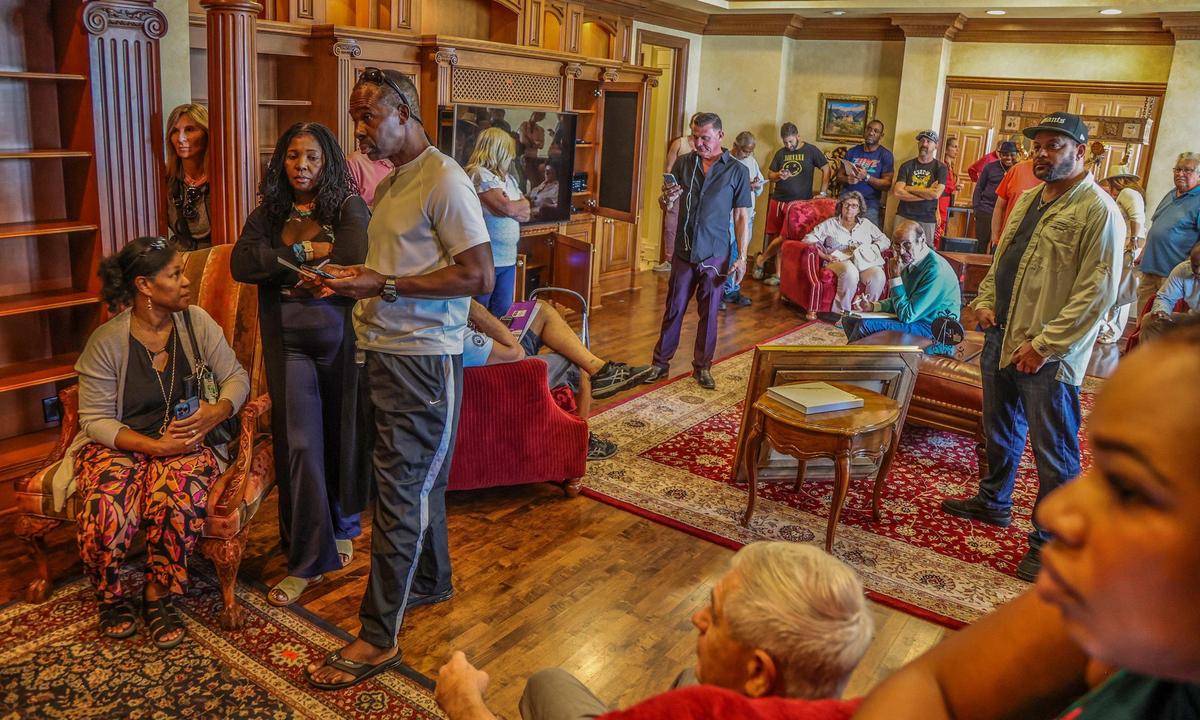 A group of people attended an auction on Saturday, Dec. 23, 2023, hosted by Auctions4America to buy the content and pieces of La Maison Blanche —the White House — a 1930s neoclassical estate on the Intracoastal in Fort Lauderdale before it is demolished in early 2024 and replaced by a 20,000-square-foot modernist home.