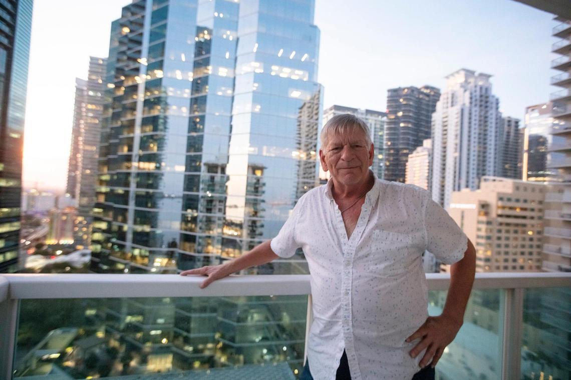 Terence Tennant stands on the balcony of his unit at the Solaris at Brickell Bay in Miami on Tuesday, Jan. 21, 2025. “I love this place, and I don’t want to lose it,” Tennant said in an interview.
