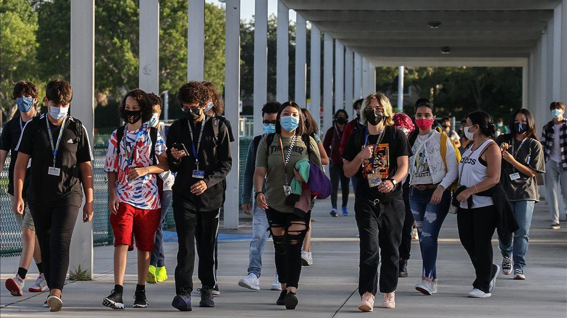 Cypress Bay High School students enter the campus in Weston as Broward County goes back to school under a school board mask mandate on Aug. 18.