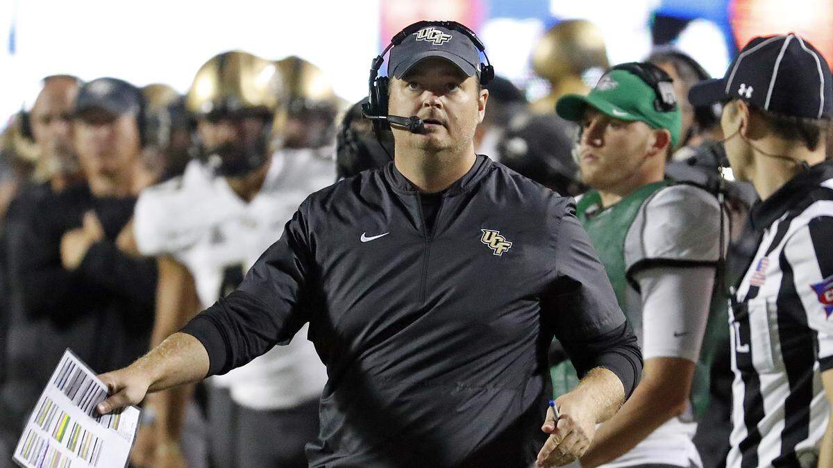 Central Florida head coach Josh Heupel watches a replay on the scoreboard during the first half of an NCAA college football game against East Carolina in Greenville, N.C., Saturday, Oct. 20, 2018.