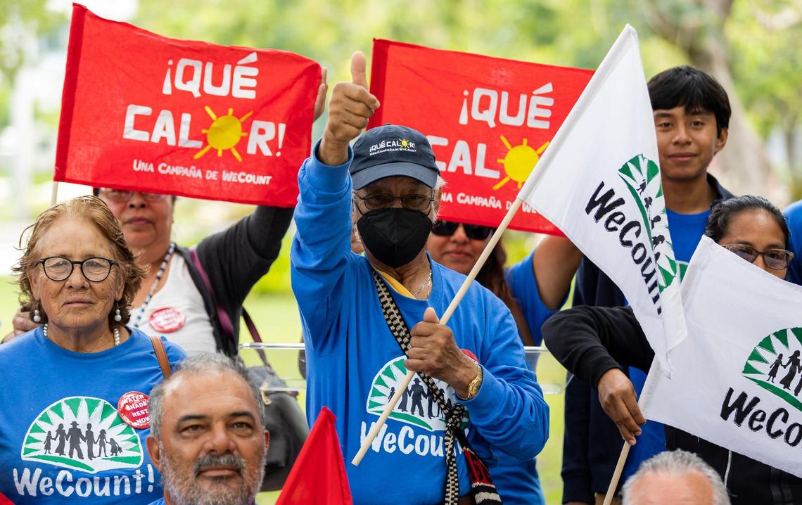Jose Delgado Soto, 74, center, a member of WeCount! and a farmworker who suffered two heat strokes, reacts after after attending a press conference outside of Government Center on May 15, 2023, in downtown Miami. The event was held to announce the start of the heat season throughout Miami-Dade County.