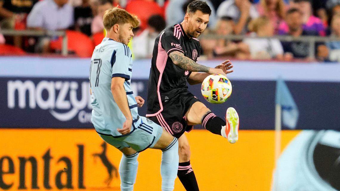 Apr 13, 2024; Kansas City, Kansas, USA; Inter Miami CF forward Lionel Messi (10) passes against Sporting Kansas City midfielder Jake Davis (17) during the second half at GEHA Field at Arrowhead Stadium. Mandatory Credit: Jay Biggerstaff-USA TODAY Sports