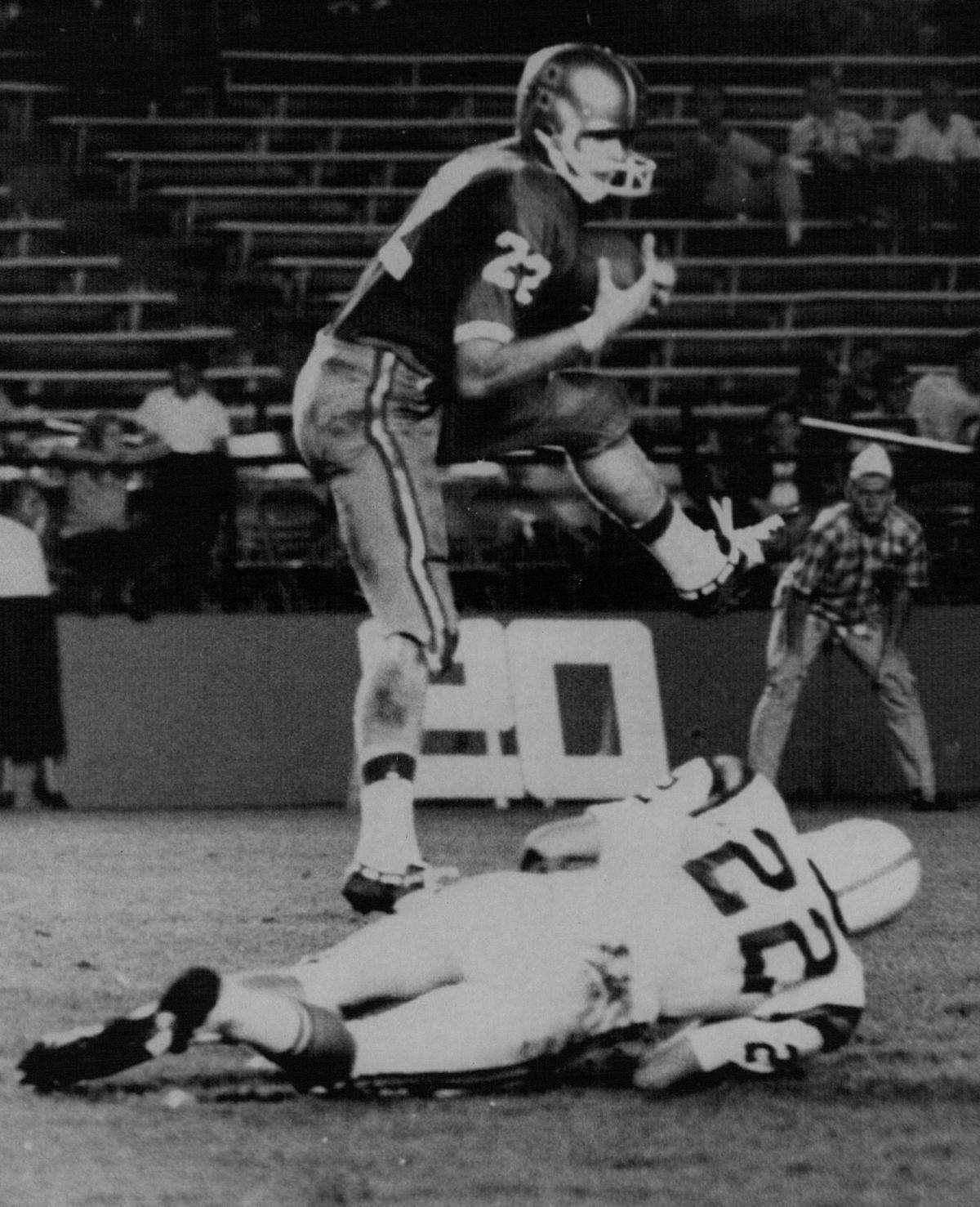 Miami Hurricane back Gary Mick jumps for a pass against the Gators in the Miami Orange Bowl in 1968