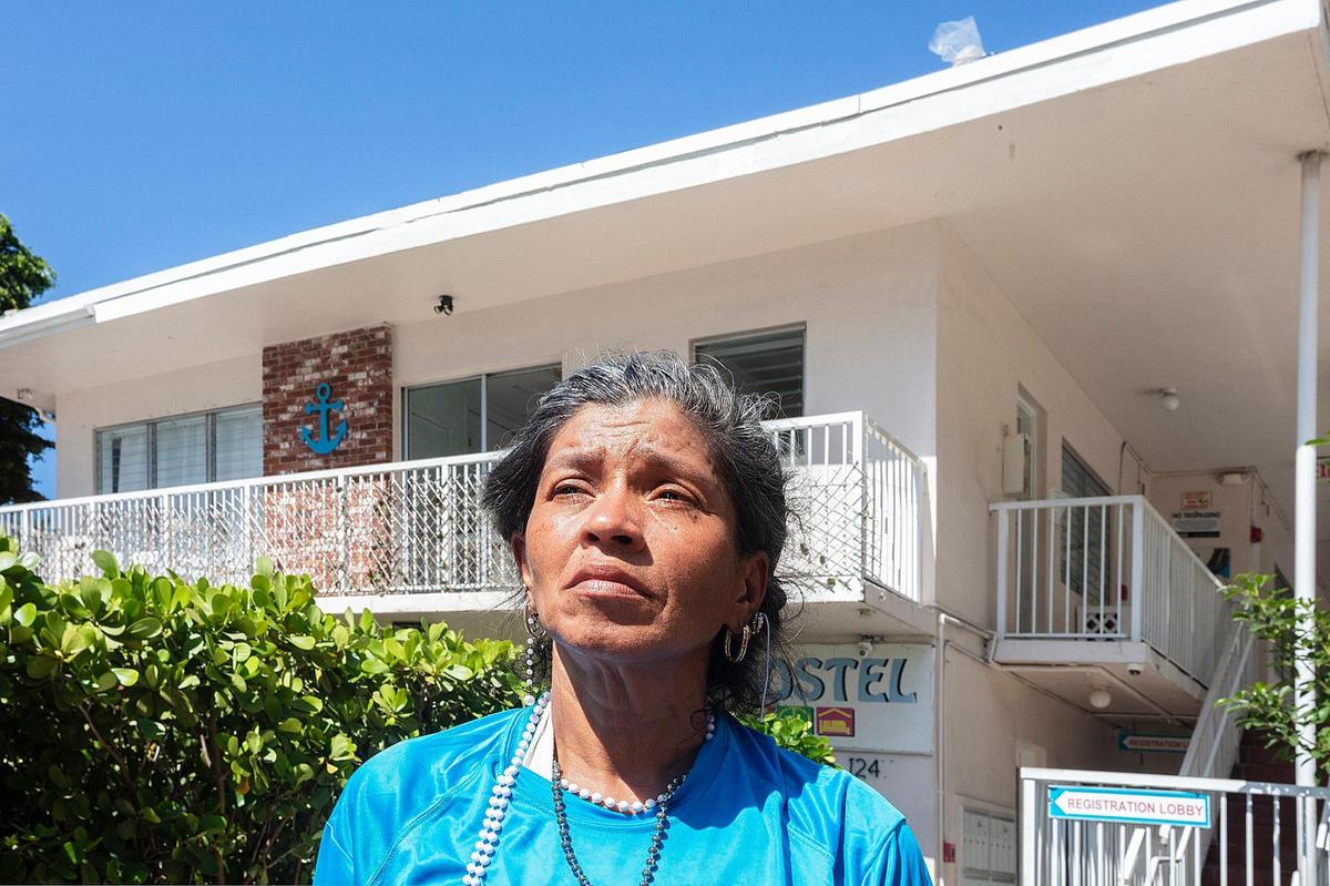 Griselda Balmaced, a resident of Bikini Hostel, stands outside the Miami Beach building on Monday, June 9, 2025. The hostel, which currently shelters people experiencing homelessness through the Miami-Dade Homeless Trust, is set to be sold and demolished by a local developer, leaving residents uncertain about their future.