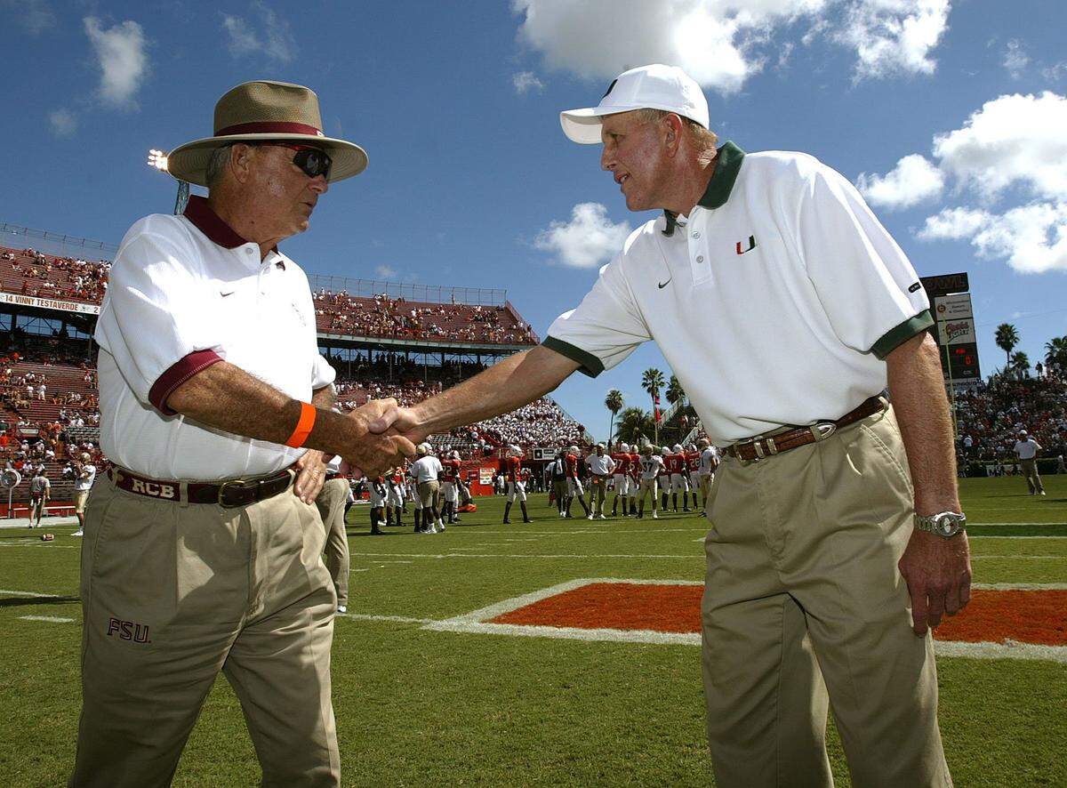 In 2002, FSU coach Bobby Bowden and UM coach Larry Coker greet each other at mid-field before the game at the orange Bowl.