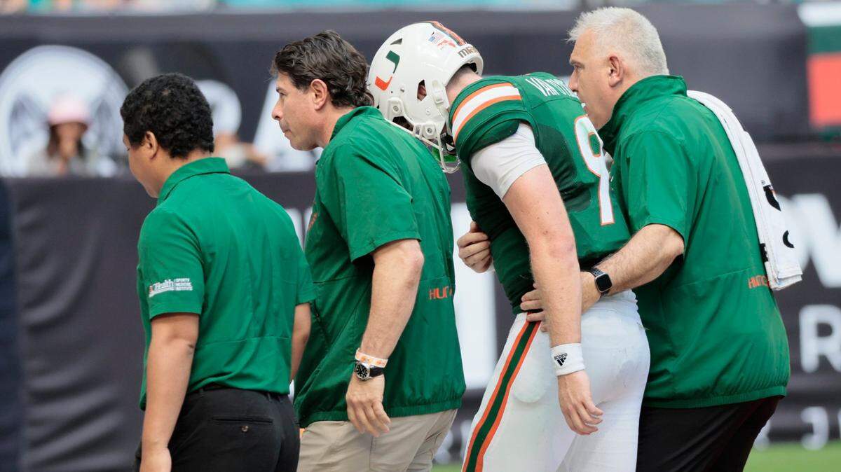 Miami Hurricanes quarterback Tyler Van Dyke (9) is assisted off the field after getting injured in the second quarter during game against the Duke Blue Devils at Hard Rock Stadium in Miami Gardens on Saturday, October 22, 2022.