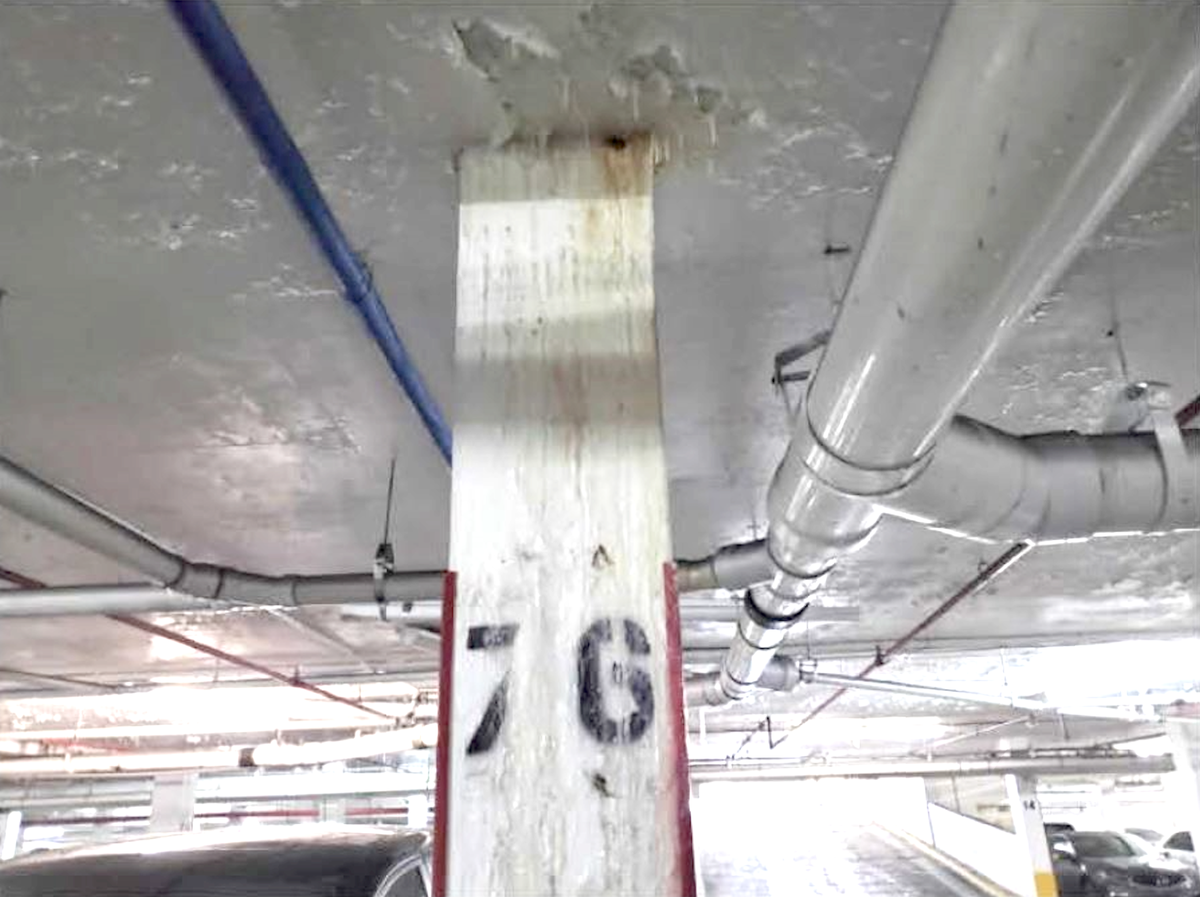 Water poured down a column in the part of the garage located below the Champlain Towers South pool deck, shown in this photo taken by Morabito Consultants in the months prior to the collapse.