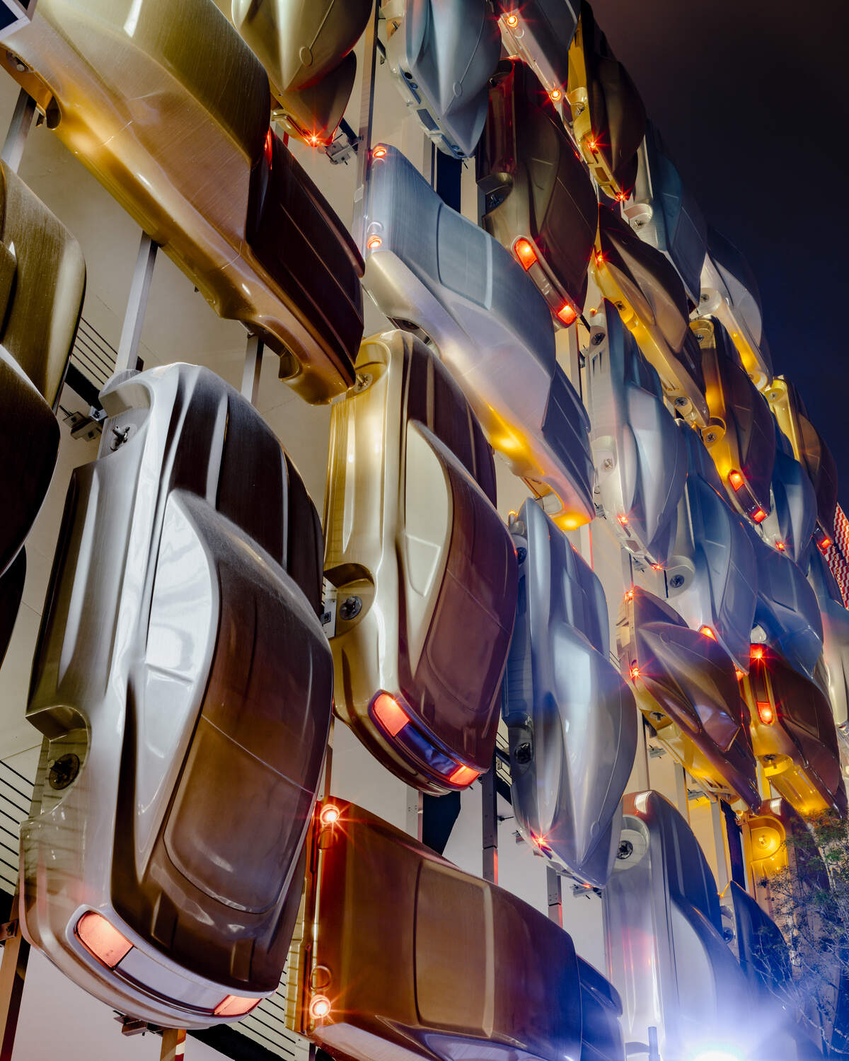 The Museum Garage's "Urban Jam" facade, by Spanish architects Clavel Arquitectos, consists of 45 car bodies bolted to the garage and arranged in a traffic logjam.
