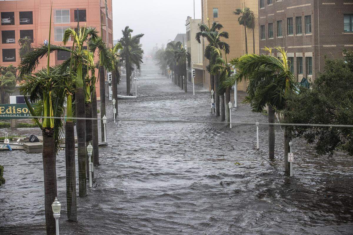 Streets of downtown Fort Myers get flooded due to the surge of the Caloosahatchee River as Hurricane Ian hits the west coast of Florida as a Category 4 storm on Wednesday, Sept. 28, 2022.