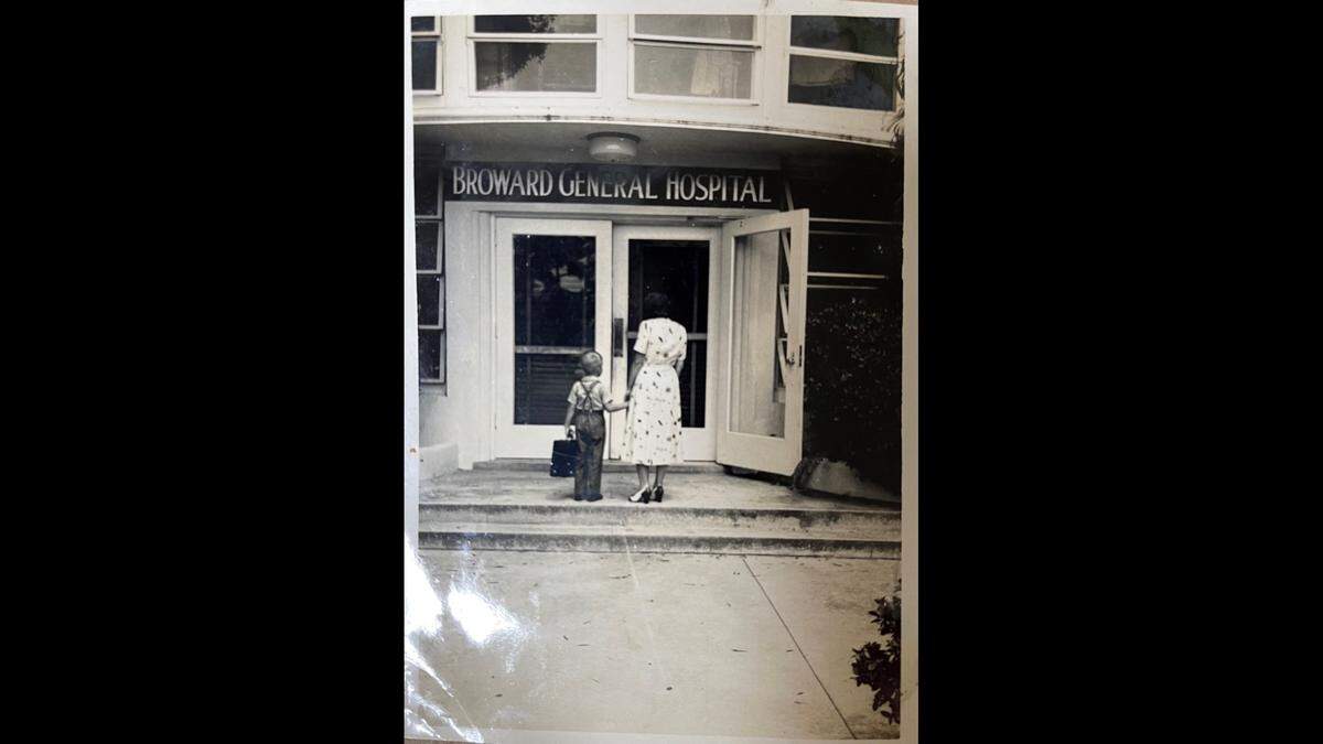 A woman with a young boy in front of Broward General Hospital on April 28, 1953.