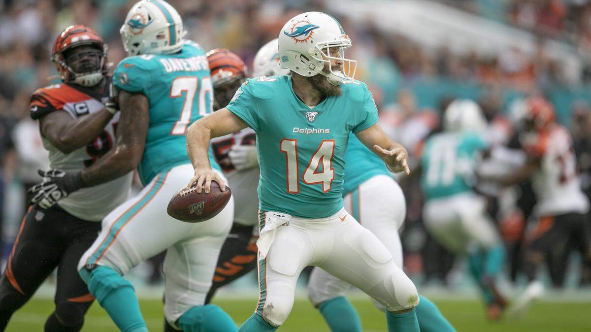 Miami Dolphins quarterback Ryan Fitzpatrick (14) sets up to pass in the first quarter as the Miami Dolphins host the Cincinnati Bengals at Hard Rock Stadium in Miami Gardens on Sunday, December 22, 2019.