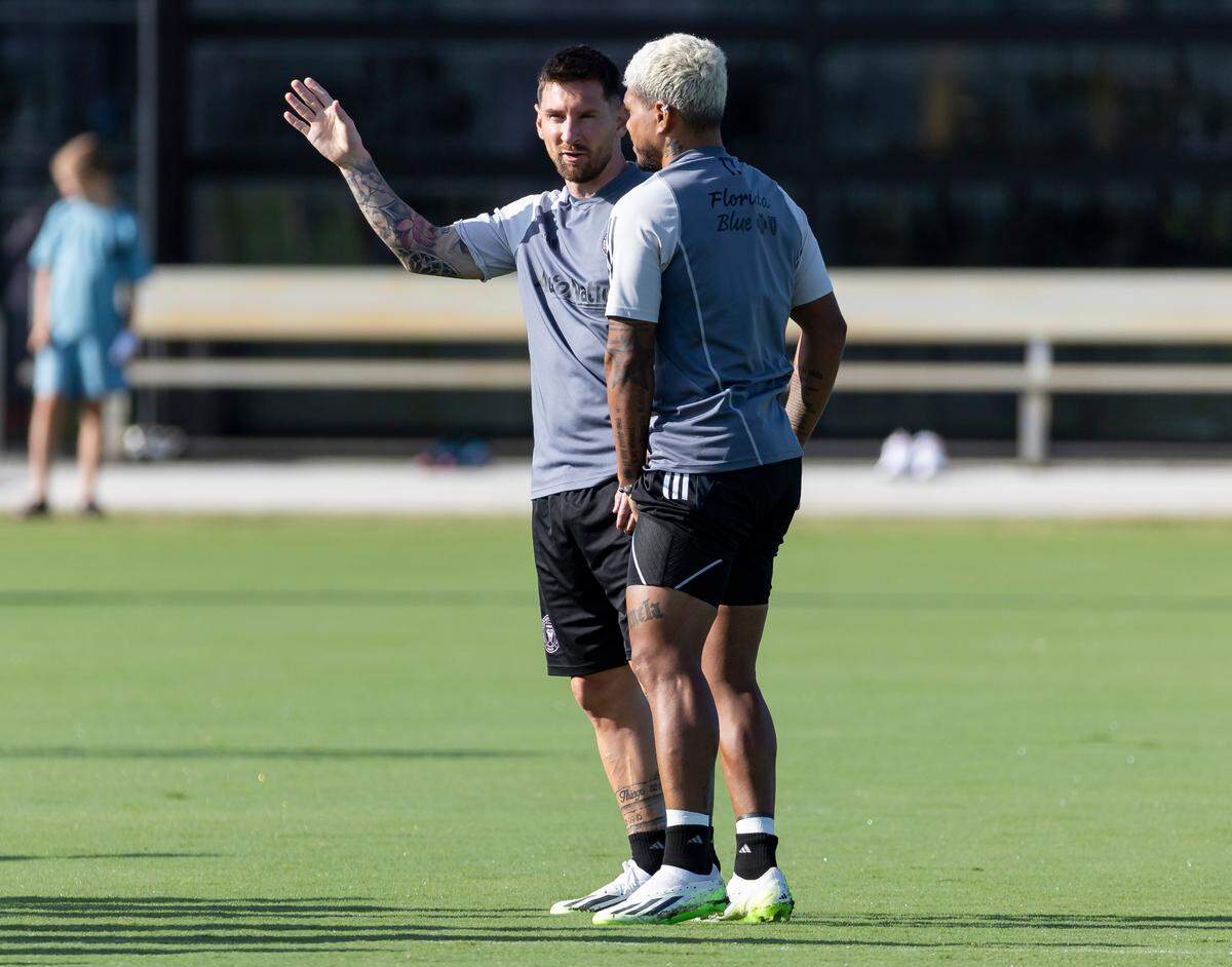 Inter Miami forwards Lionel Messi (10) and Josef Martínez (17) talk during a team practice session at the Florida Blue Training Center on Tuesday, July 18, 2023, in Fort Lauderdale, Fla.