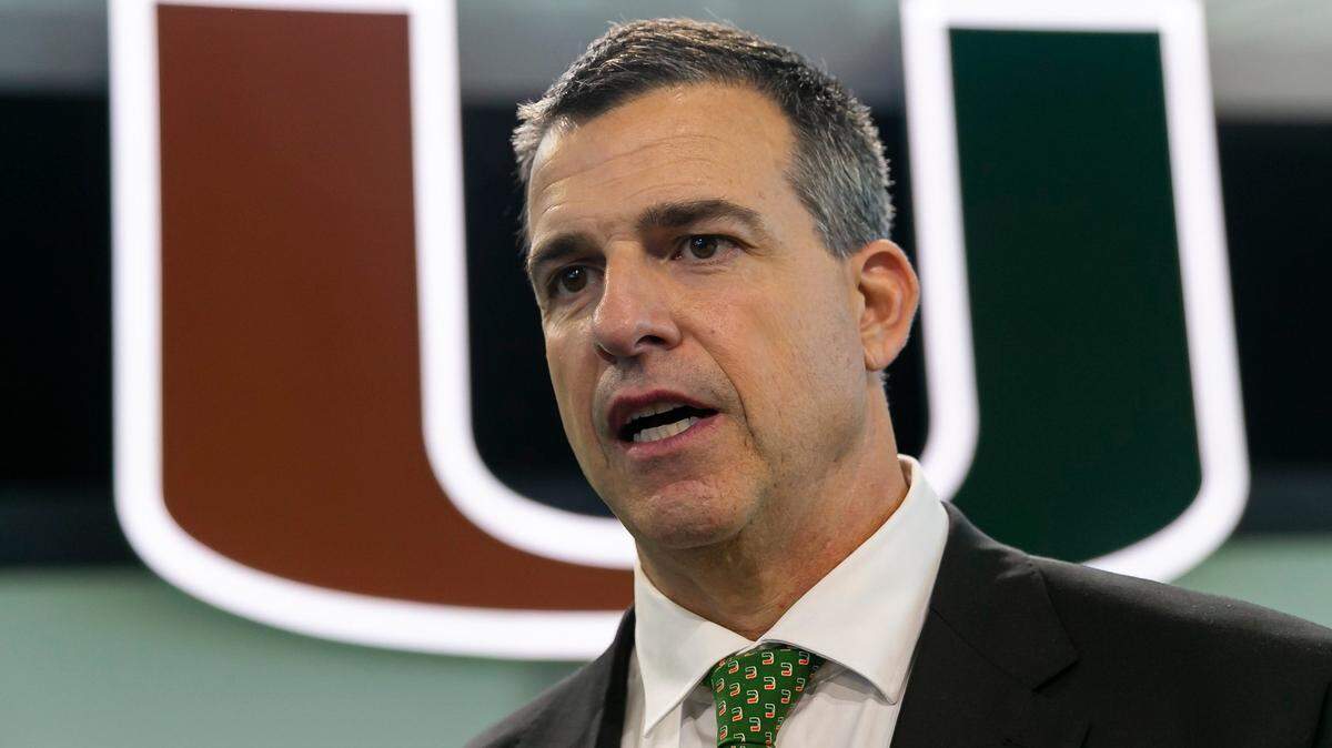 Mario Cristobal, the newly hired head football coach of the Miami Hurricanes, talks to the media after holding a press conference at the Carol Soffer Indoor Practice Facility inside the University of Miami in Coral Gables, Florida on Tuesday, December 7, 2021.
