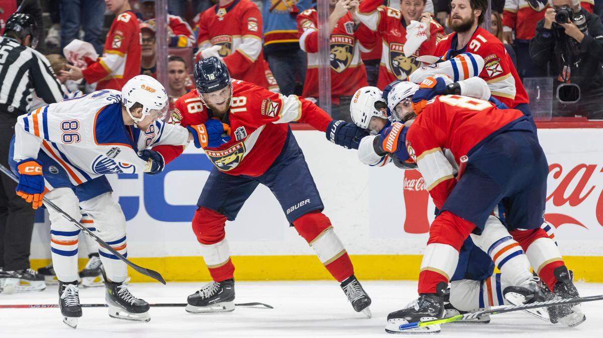 Edmonton Oilers defenseman Philip Broberg (86) and Florida Panthers center Steven Lorentz (18) fight in the second period of Game 1 of the NHL Stanley Cup Finals at the Amerant Bank Arena on Saturday, June 8, 2024, in Sunrise, Fla.