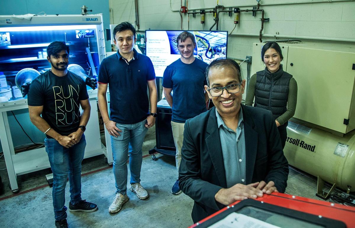 Dr. Arvind Agarwal, FIU chair and distinguished professor, mechanical and materials engineering, with his students at the College of Engineering & Computing.
