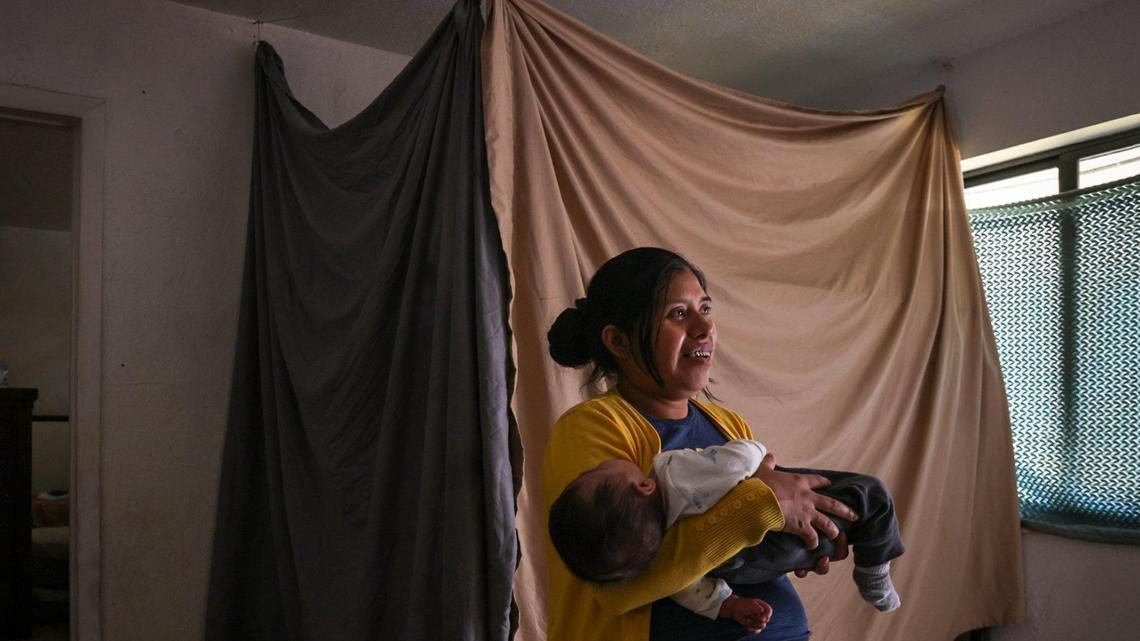 Marina C., 30, lives in a one-bedroom apartment in South Miami-Dade with her husband and four children. They struggle with high rent and low wages, leaving them with limited funds for essentials like furniture, a larger apartment, baby items, clothing, food and a computer for their children. Marina reflects on seeking a better life while caring for her two-month-old son, Anthony J., on Dec. 18, 2024, in a Miami Herald Wish Book story.