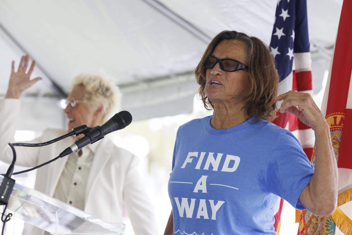 Bonnie Stoll, Nyad's coach, speaks during a ceremony naming a street marker after Diana Nyad, the only person to swim from Cuba to Florida without a shark cage, on Thursday, Nov. 6, 2025, at Las Olas Oceanside Park in Fort Lauderdale, Fla.