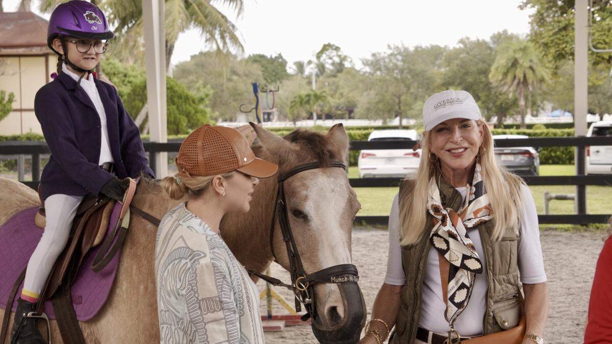 Quinn Osorno is on Cinnamon with Cozy Salazar and Sissy DeMaria-Koehne at Whispering Manes Therapeutic Riding Center.