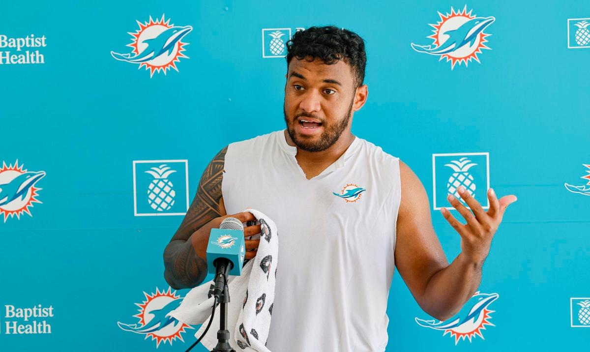 Miami Dolphins quarterback Tua Tagovailoa (1) speaks to reporters after practice at the Baptist Health Training Complex in Miami Gardens on Wednesday, August 23, 2023.